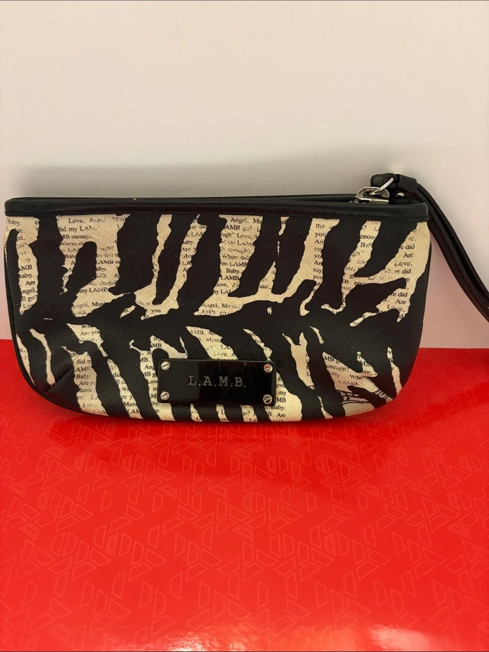 L.A.M.B. Black and Cream Zebra-Print Clutch with Logo Plate
